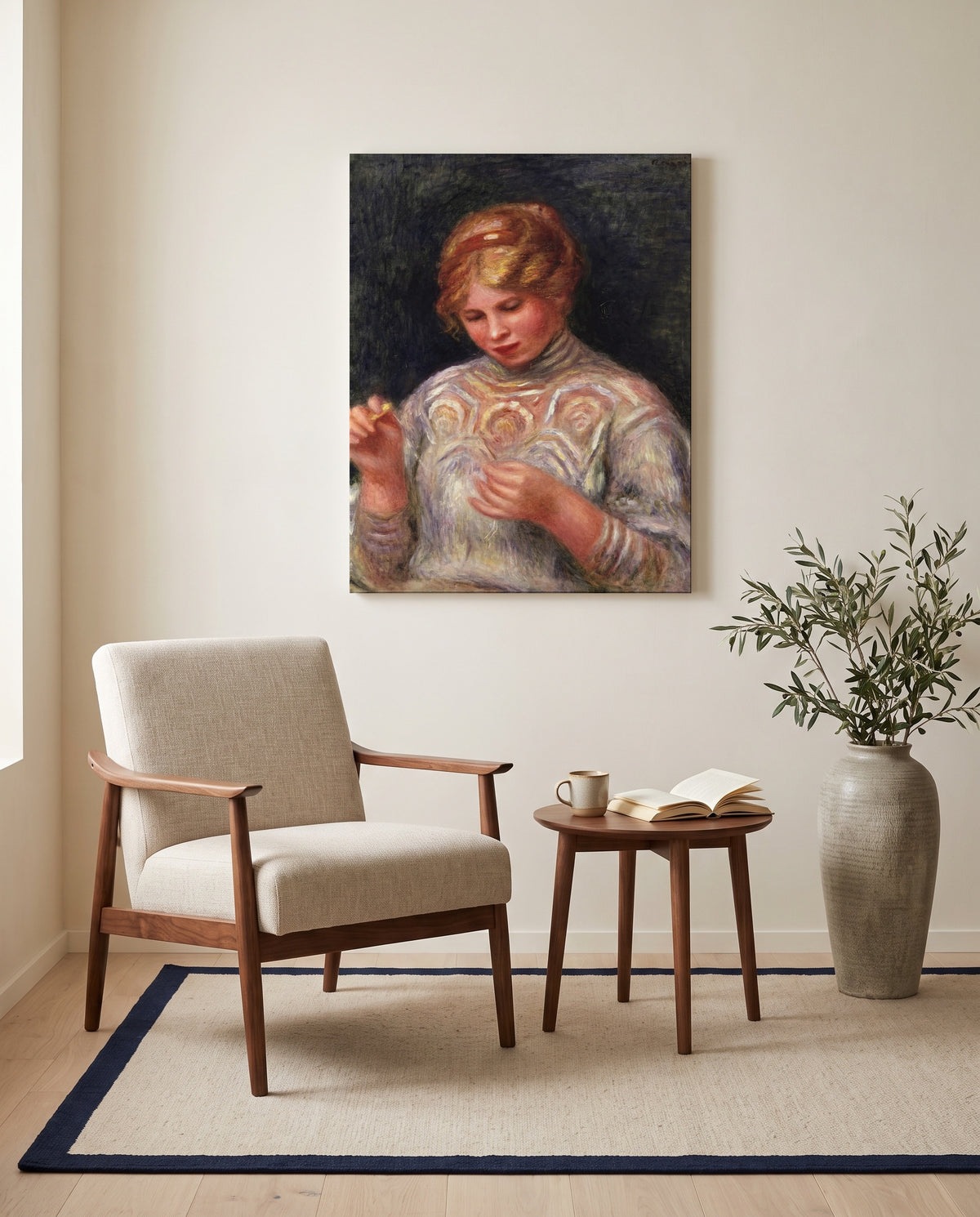 Girl Tatting by Pierre-Auguste Renoir as a stretched canvas above a linen lounge chair in a reading corner