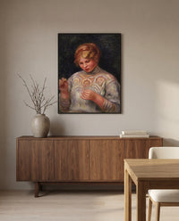 Girl Tatting by Pierre-Auguste Renoir in a black frame above a walnut sideboard in a dining room