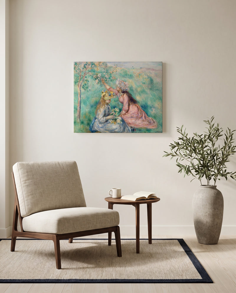 Girls Picking Flowers by Pierre-Auguste Renoir as a stretched canvas above a linen lounge chair in a reading corner