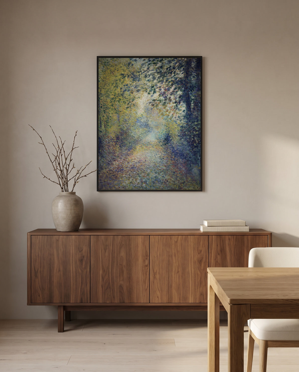 In the Woods by Pierre-Auguste Renoir in a black frame above a walnut sideboard in a dining room