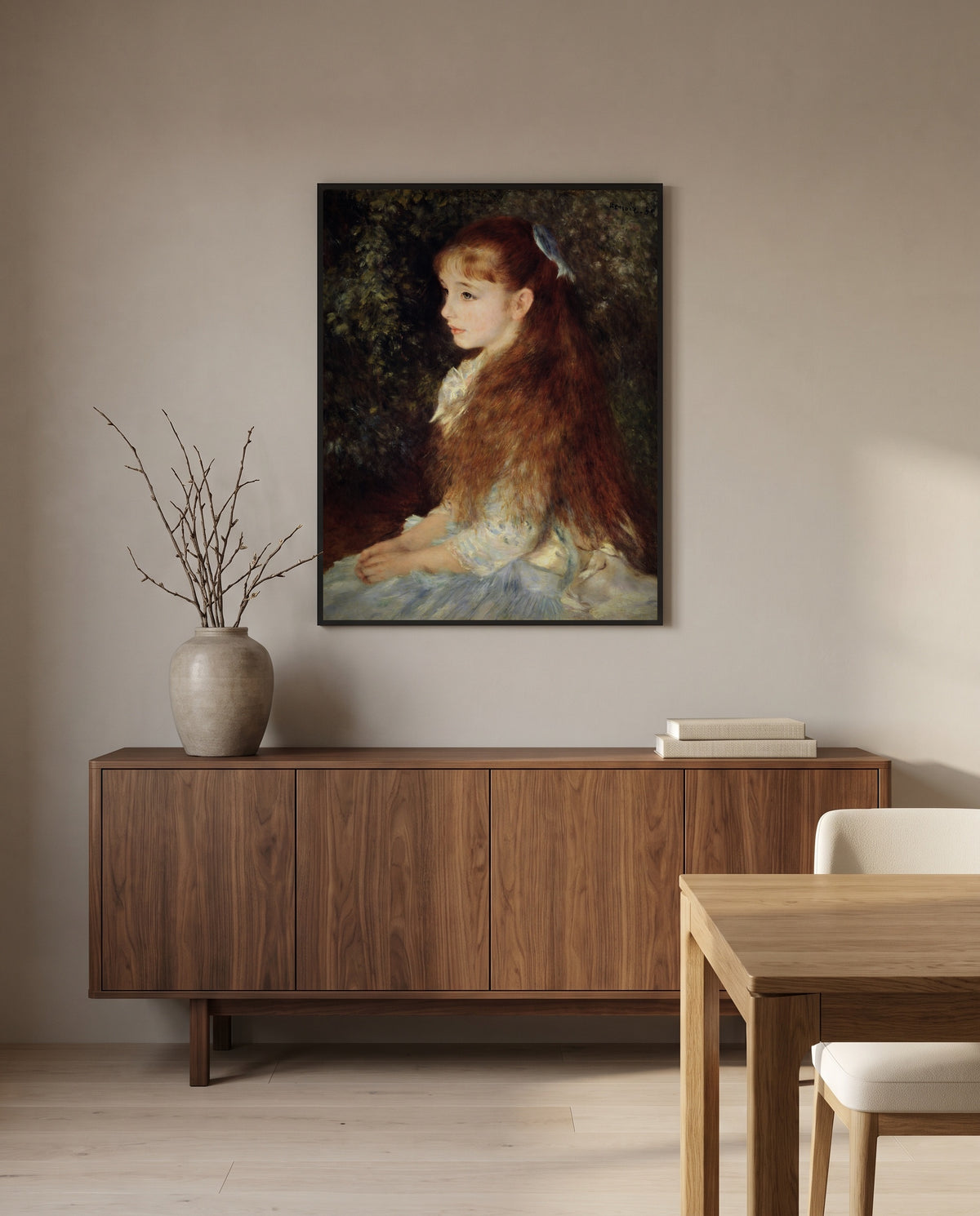 Little Irène by Pierre-Auguste Renoir in a black frame above a walnut sideboard in a dining room