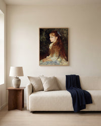 Little Irène by Pierre-Auguste Renoir framed in natural oak above a cream sofa in a warm living room