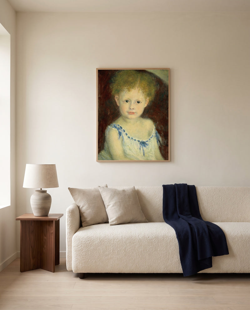 Jacques Bergeret as a Child by Pierre-Auguste Renoir framed in natural oak above a cream sofa in a warm living room