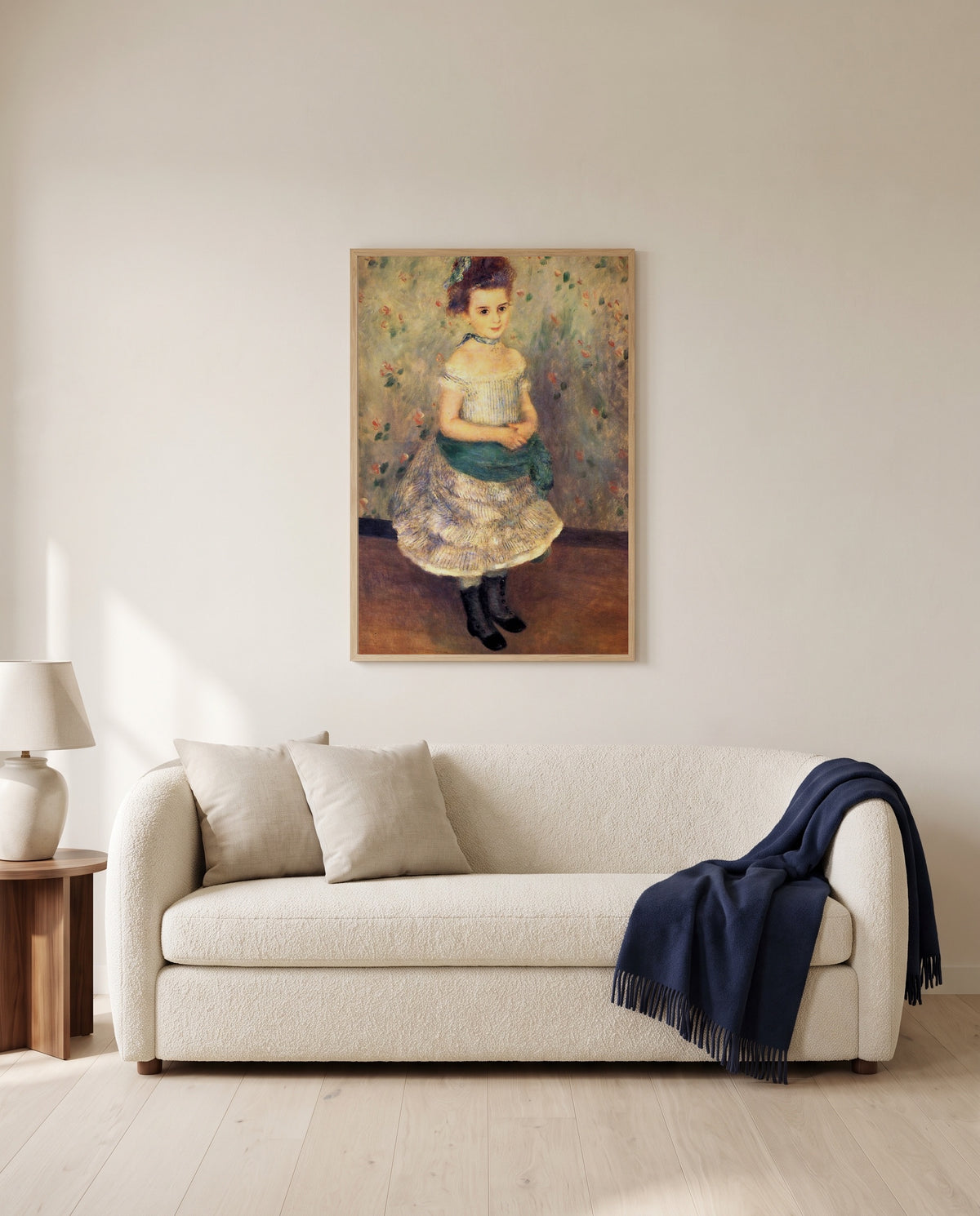 Jeanne Durand-Ruel by Pierre-Auguste Renoir framed in natural oak above a cream sofa in a warm living room