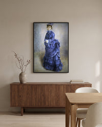 La Parisienne by Pierre-Auguste Renoir in a black frame above a walnut sideboard in a dining room