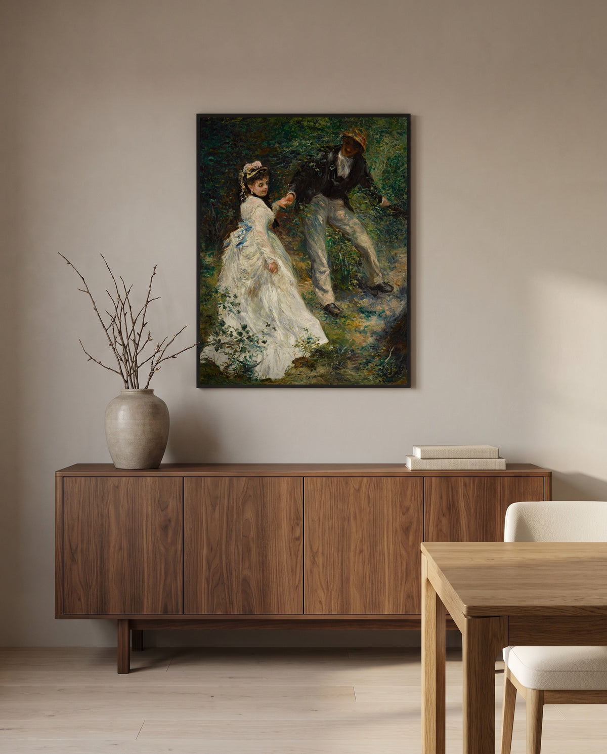 La Promenade by Pierre-Auguste Renoir in a black frame above a walnut sideboard in a dining room