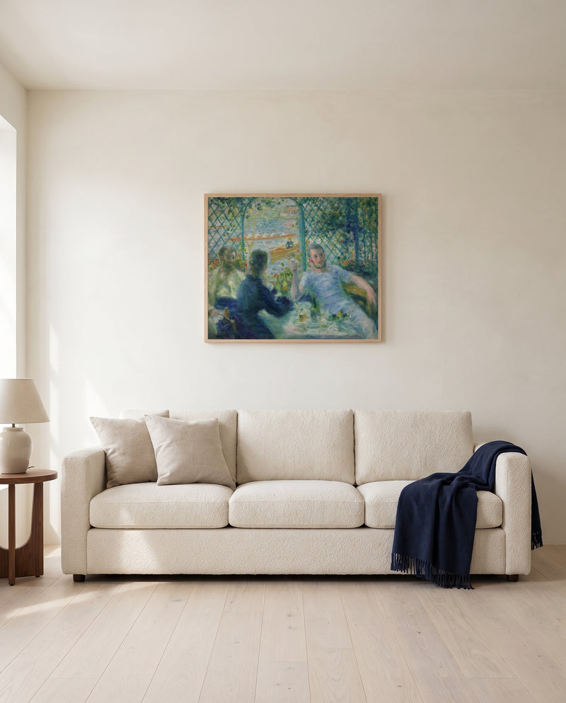 Lunch at the Restaurant Fournaise by Pierre-Auguste Renoir framed in natural oak above a cream sofa in a warm living room