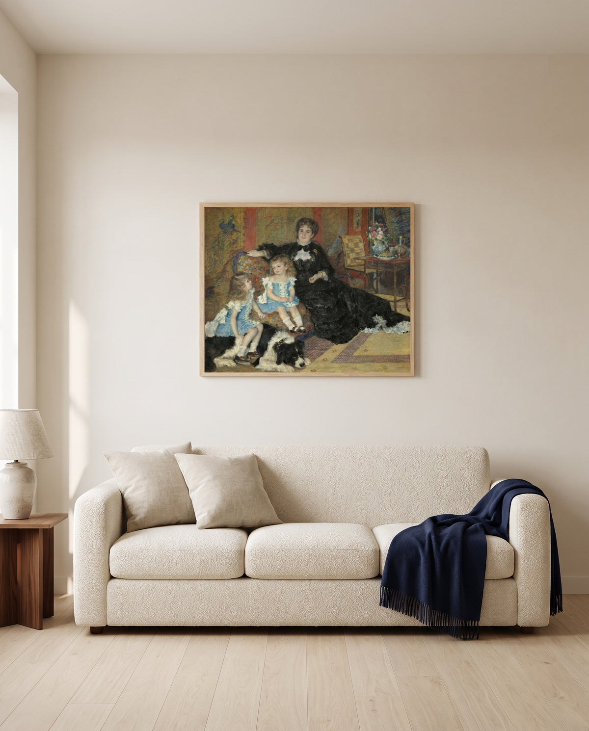 Madame Charpentier (1878) by Pierre-Auguste Renoir framed in natural oak above a cream sofa in a warm living room