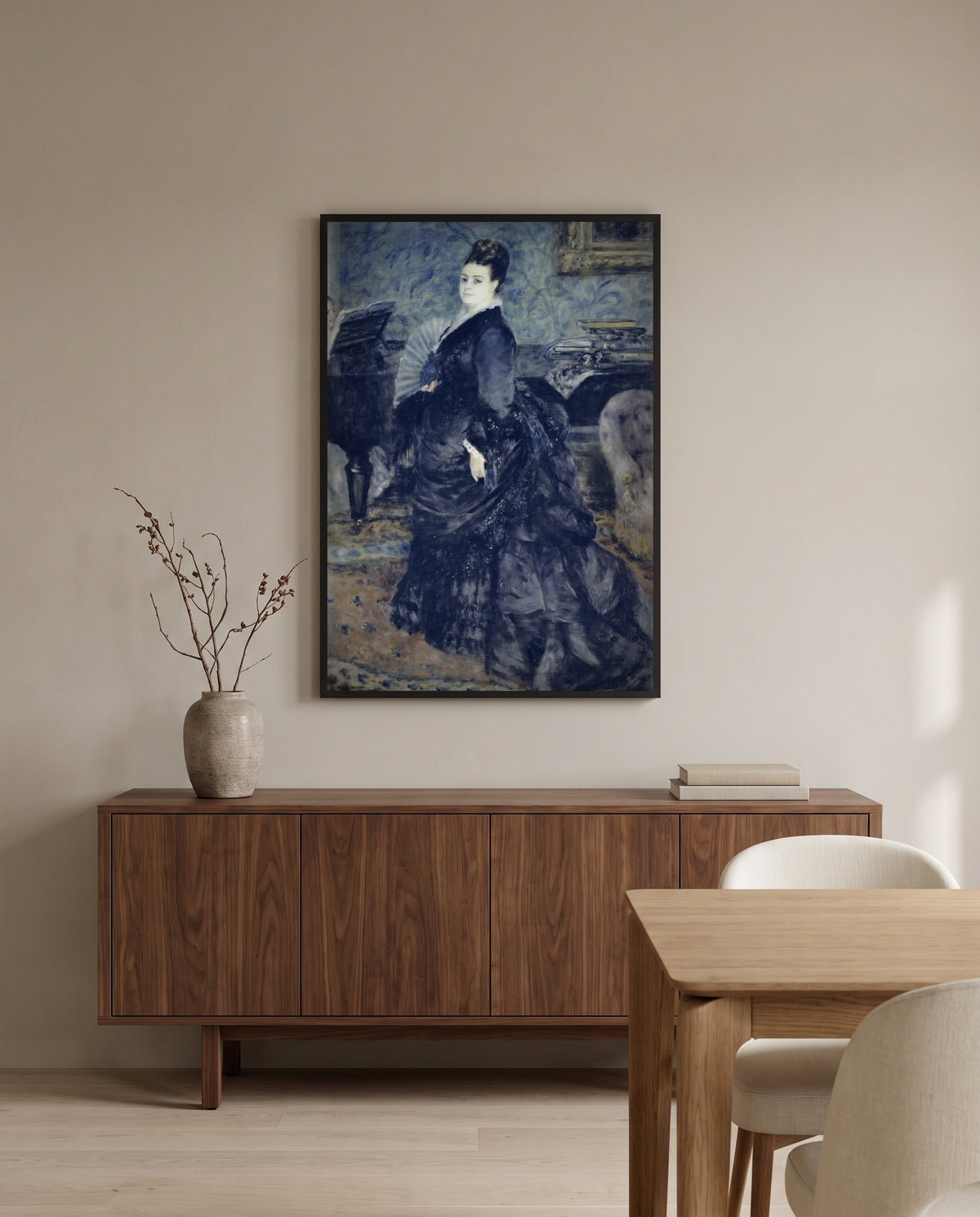 Madame Georges Hartmann by Pierre-Auguste Renoir in a black frame above a walnut sideboard in a dining room