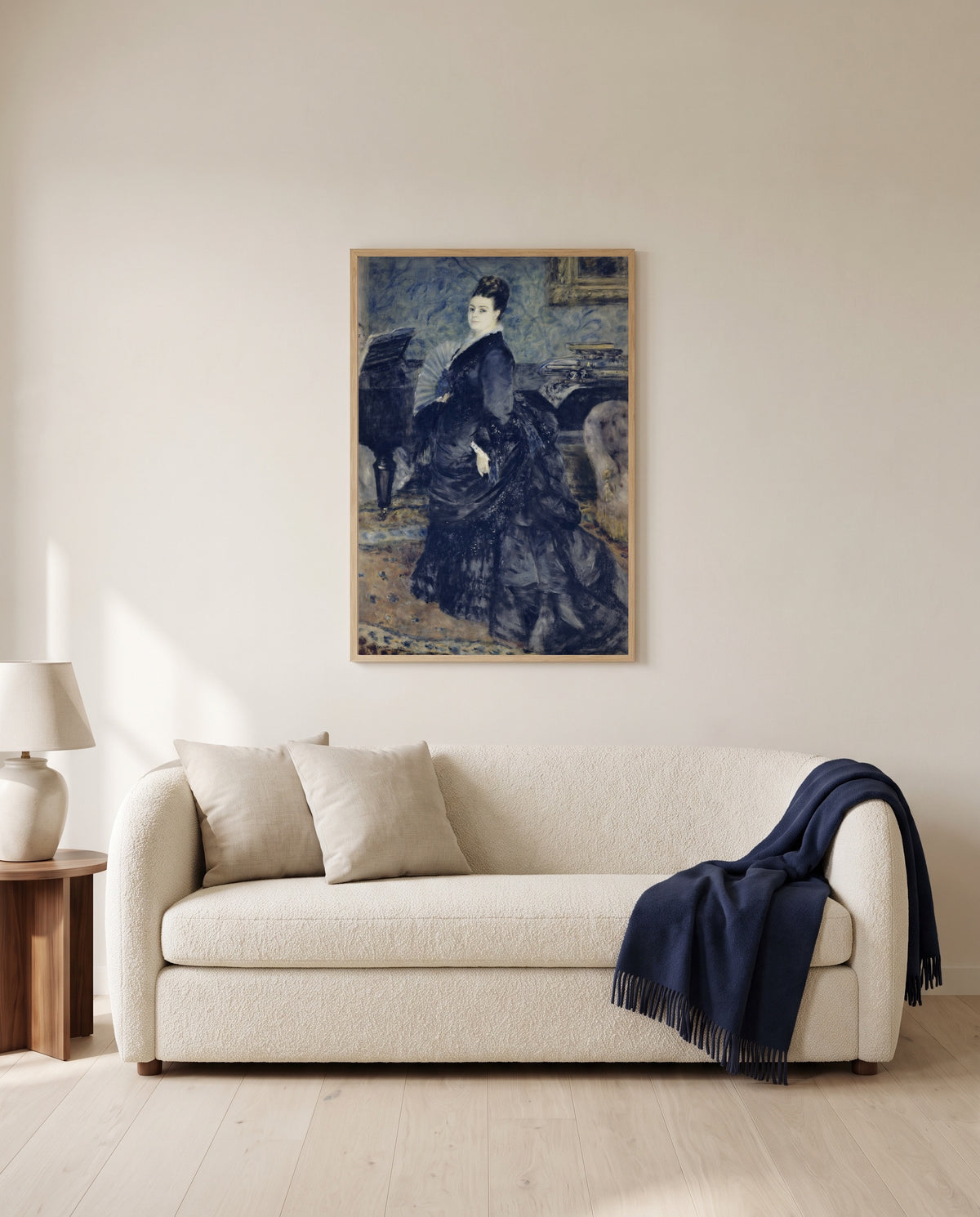 Madame Georges Hartmann by Pierre-Auguste Renoir framed in natural oak above a cream sofa in a warm living room