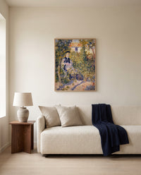 Nini in the Garden by Pierre-Auguste Renoir framed in natural oak above a cream sofa in a warm living room