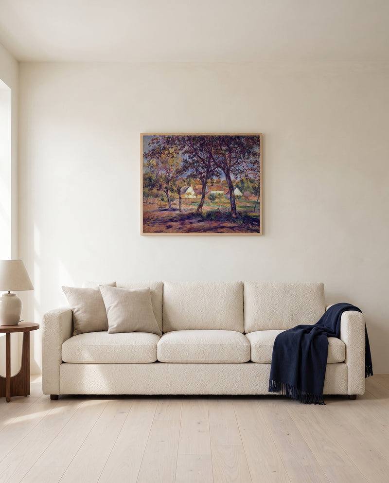 Outskirts of Pont-Aven by Pierre-Auguste Renoir framed in natural oak above a cream sofa in a warm living room