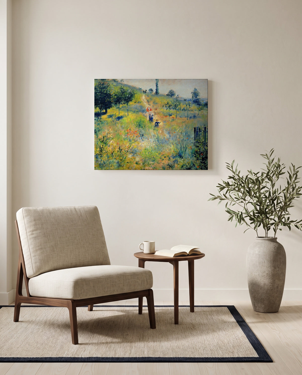 Path through Tall Grass by Pierre-Auguste Renoir as a stretched canvas above a linen lounge chair in a reading corner