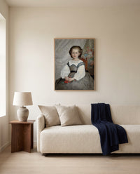 Romaine Lacaux by Pierre-Auguste Renoir framed in natural oak above a cream sofa in a warm living room