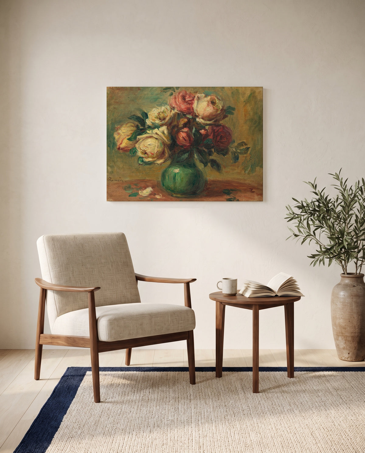 Roses in a Vase by Pierre-Auguste Renoir as a stretched canvas above a linen lounge chair in a reading corner
