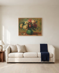 Roses in a Vase by Pierre-Auguste Renoir framed in natural oak above a cream sofa in a warm living room