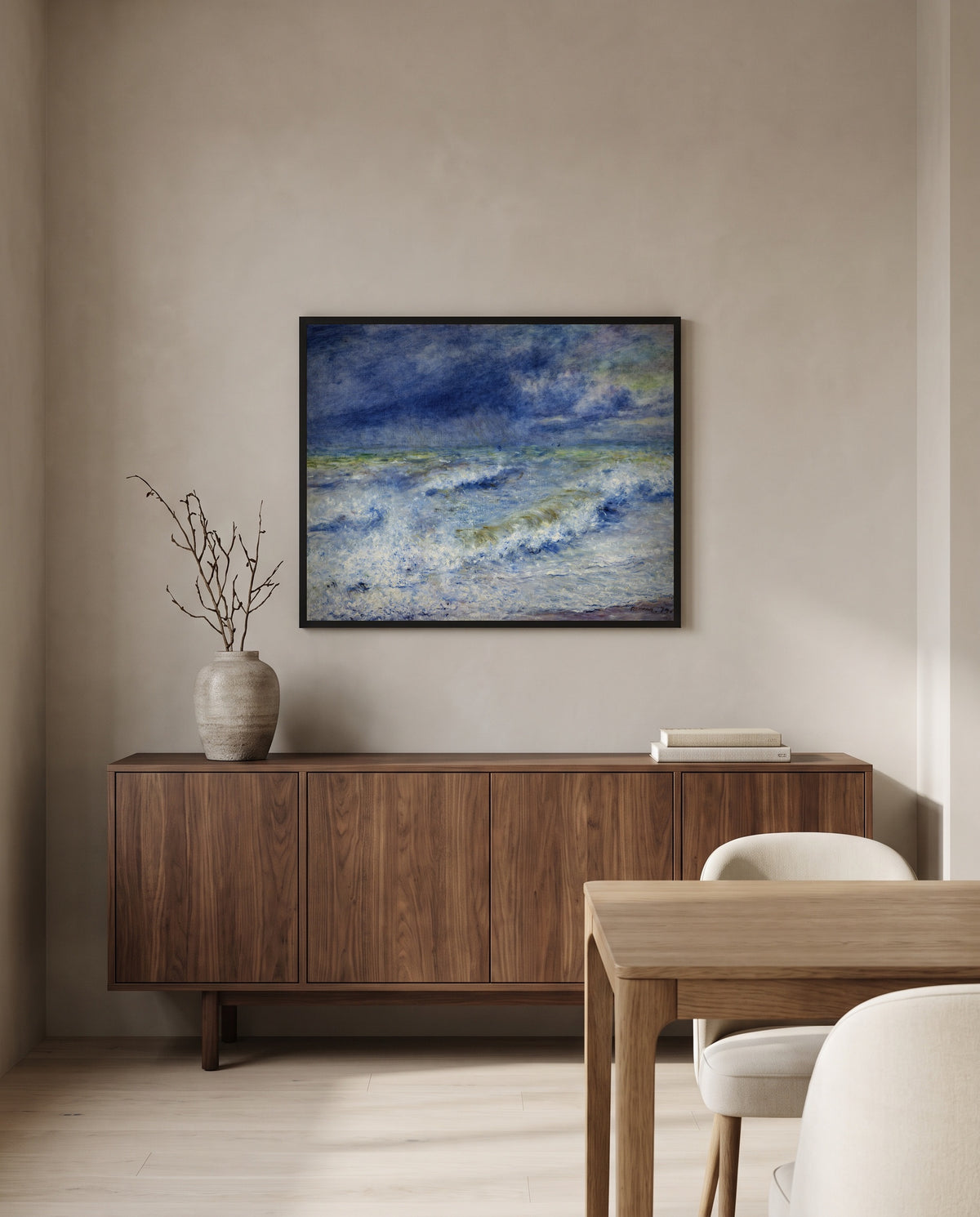 Seascape by Pierre-Auguste Renoir in a black frame above a walnut sideboard in a dining room