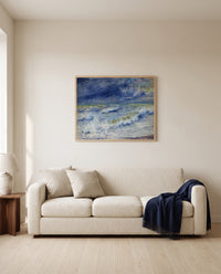 Seascape by Pierre-Auguste Renoir framed in natural oak above a cream sofa in a warm living room