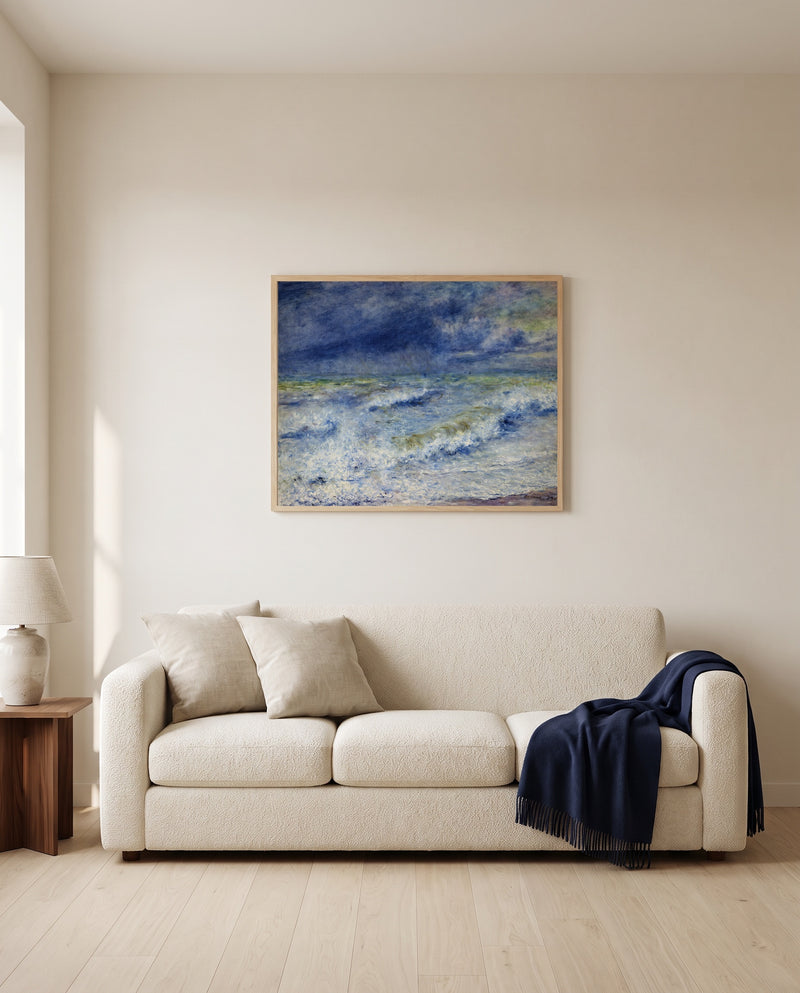 Seascape by Pierre-Auguste Renoir framed in natural oak above a cream sofa in a warm living room
