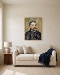 Stéphane Mallarmé by Pierre-Auguste Renoir framed in natural oak above a cream sofa in a warm living room