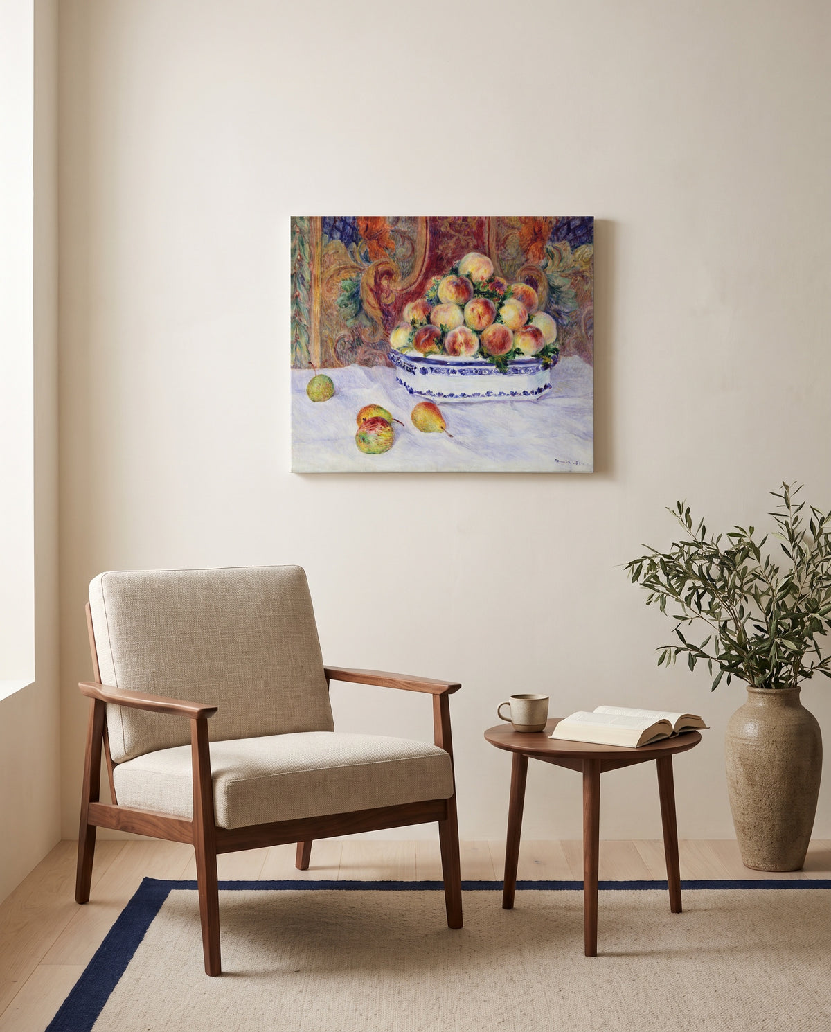 Still Life with Peaches by Pierre-Auguste Renoir as a stretched canvas above a linen lounge chair in a reading corner