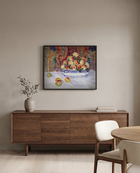 Still Life with Peaches by Pierre-Auguste Renoir in a black frame above a walnut sideboard in a dining room