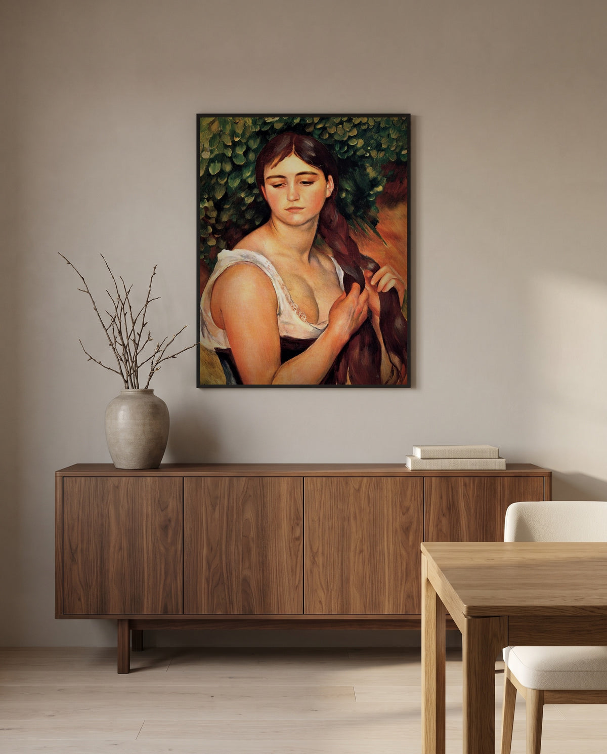 The Braid by Pierre-Auguste Renoir in a black frame above a walnut sideboard in a dining room
