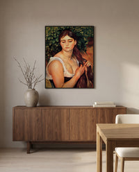 The Braid by Pierre-Auguste Renoir in a black frame above a walnut sideboard in a dining room