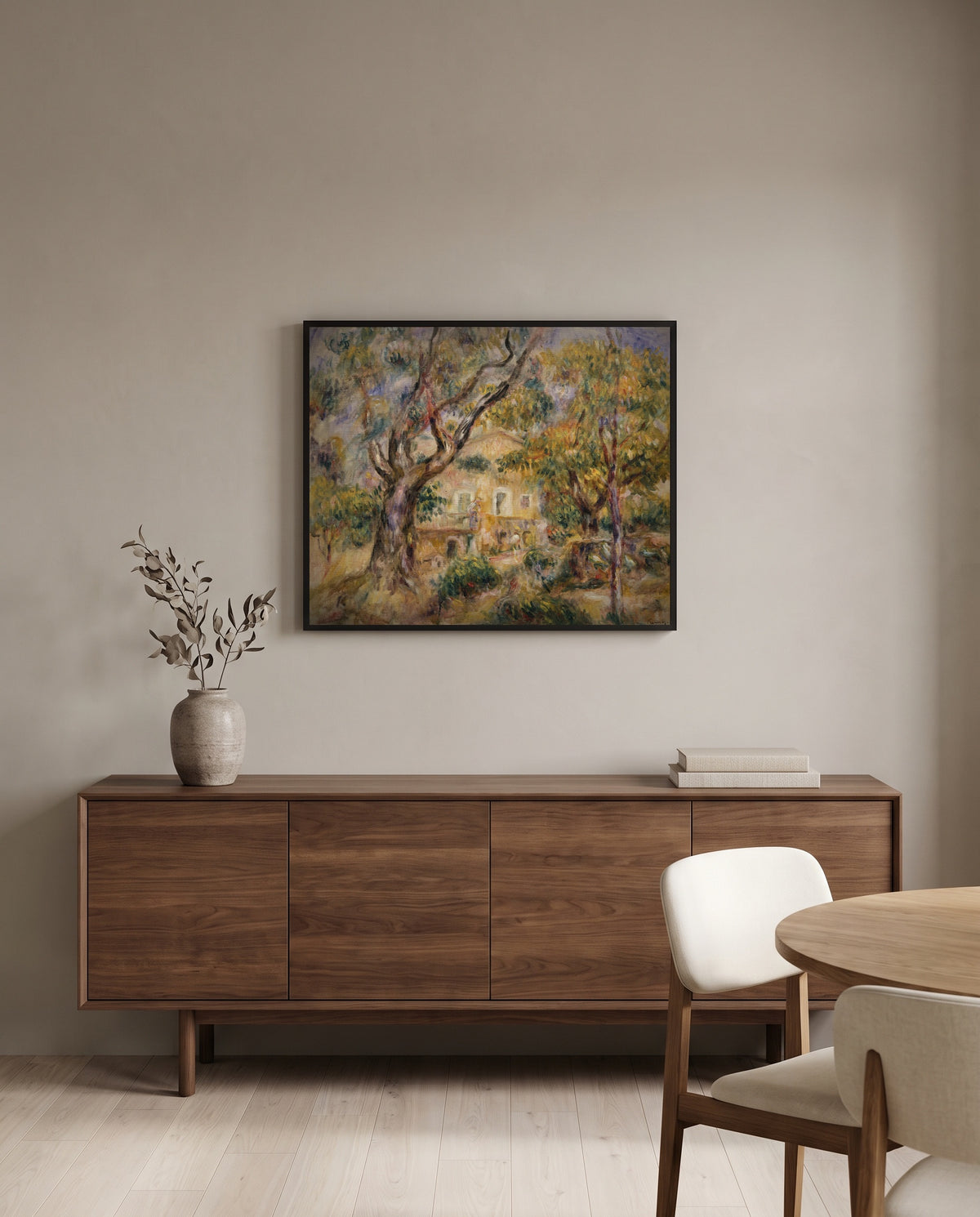 The Farm at Les Collettes by Pierre-Auguste Renoir in a black frame above a walnut sideboard in a dining room