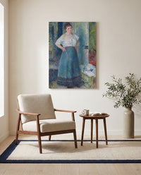 The Laundress by Pierre-Auguste Renoir as a stretched canvas above a linen lounge chair in a reading corner