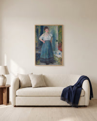 The Laundress by Pierre-Auguste Renoir framed in natural oak above a cream sofa in a warm living room