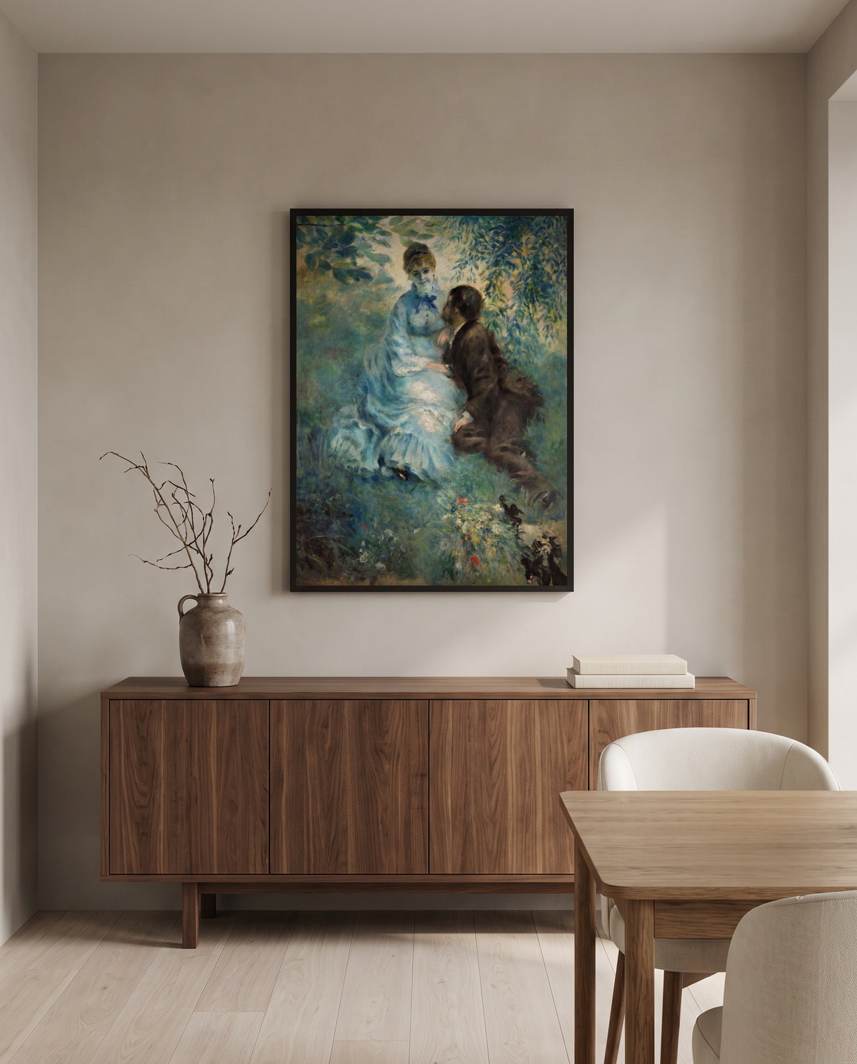 The Lovers by Pierre-Auguste Renoir in a black frame above a walnut sideboard in a dining room
