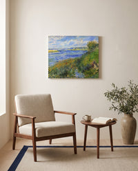 The Seine at Champrosay by Pierre-Auguste Renoir as a stretched canvas above a linen lounge chair in a reading corner