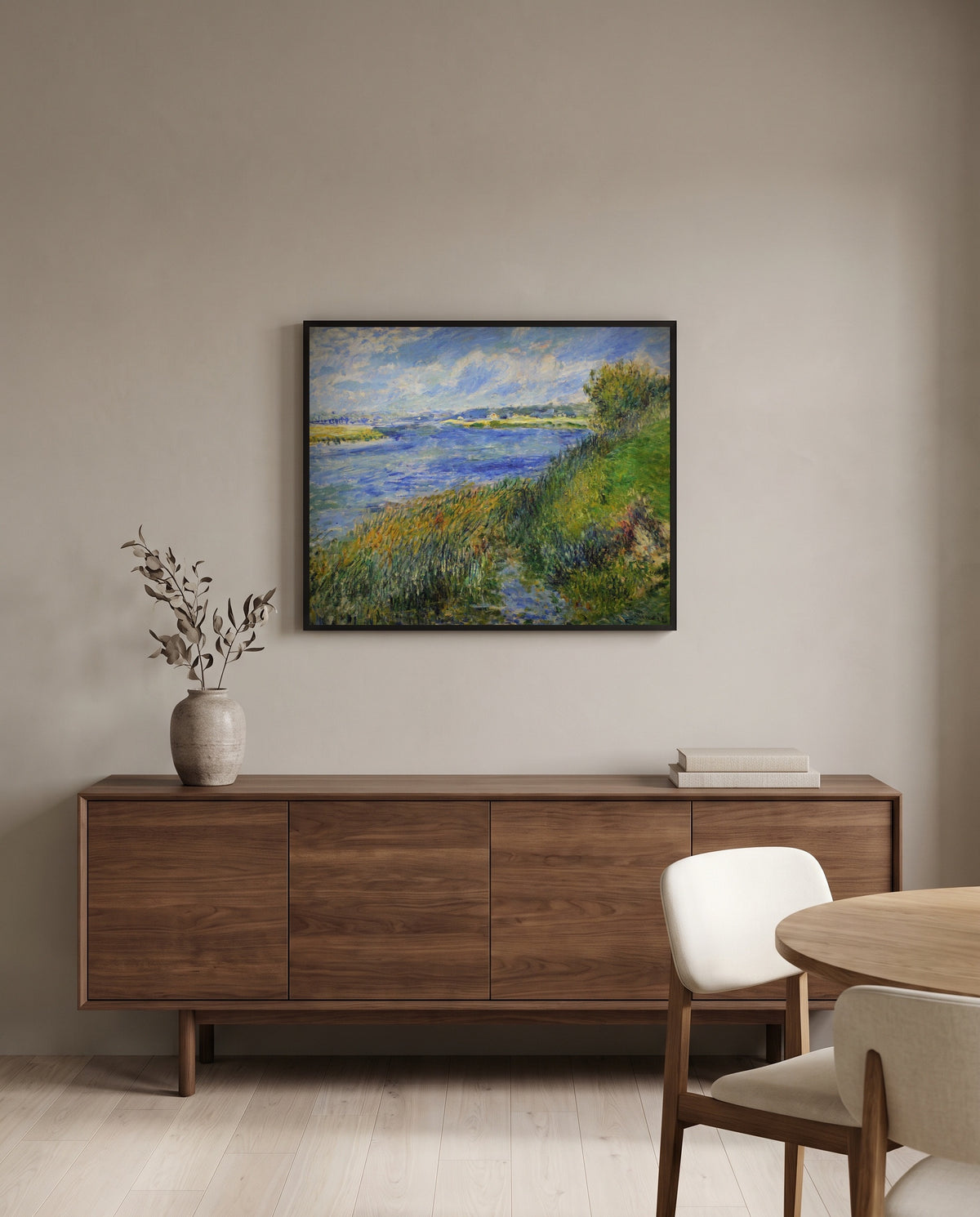 The Seine at Champrosay by Pierre-Auguste Renoir in a black frame above a walnut sideboard in a dining room