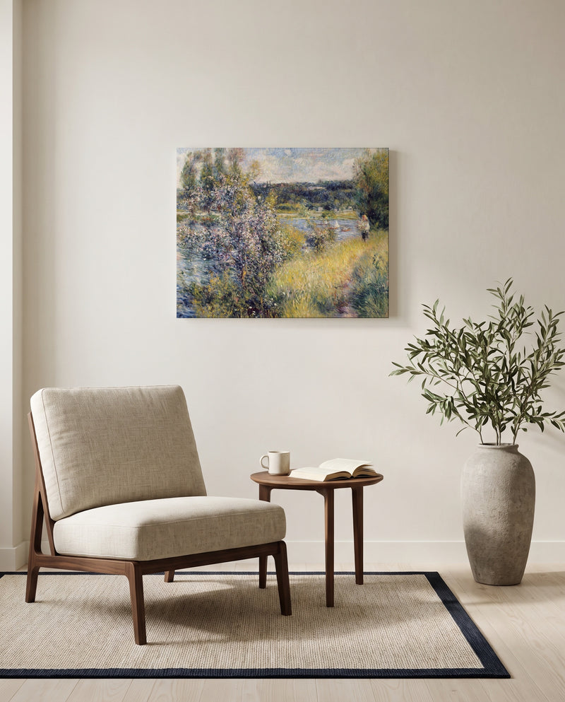 The Seine at Chatou by Pierre-Auguste Renoir as a stretched canvas above a linen lounge chair in a reading corner