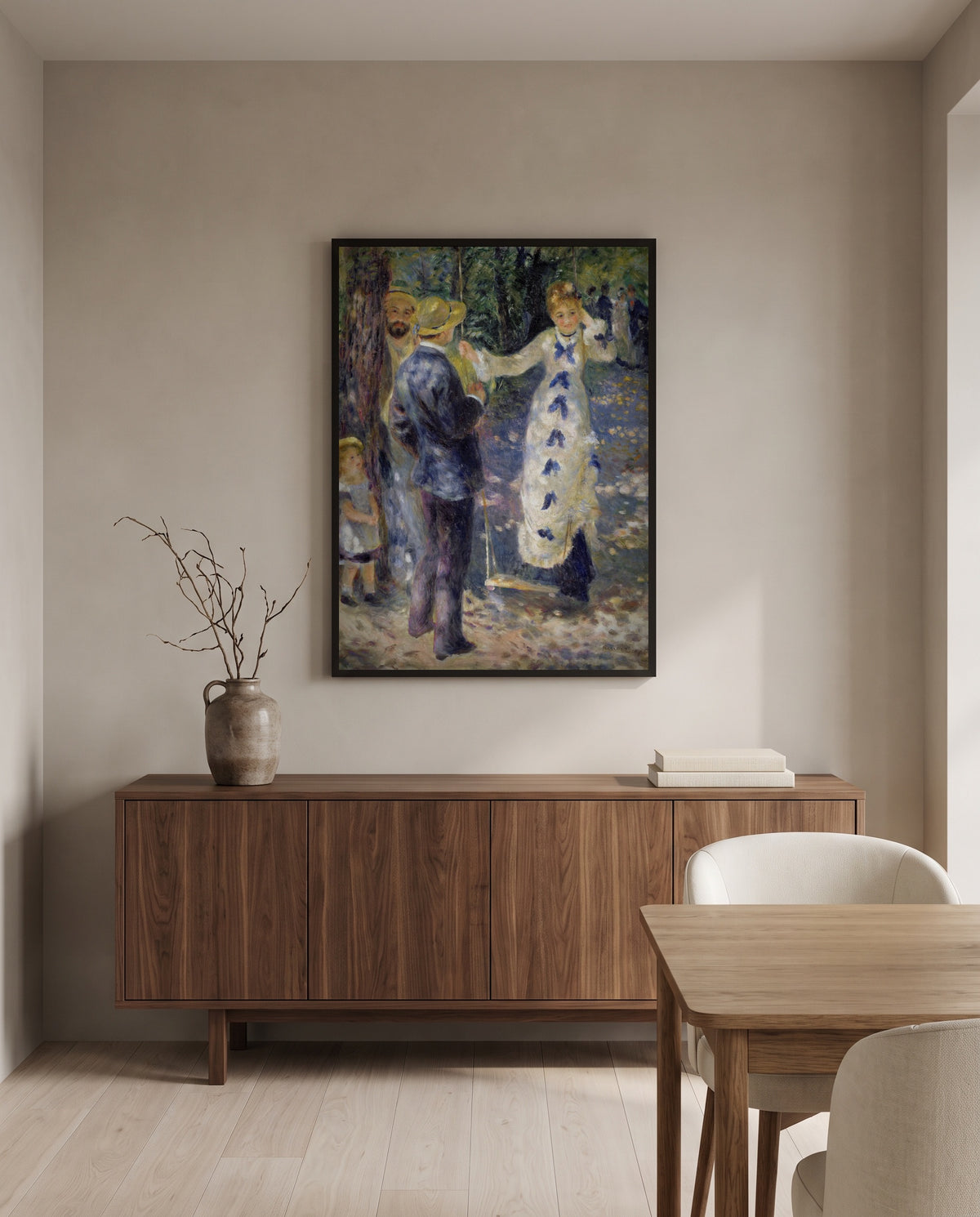 The Swing by Pierre-Auguste Renoir in a black frame above a walnut sideboard in a dining room