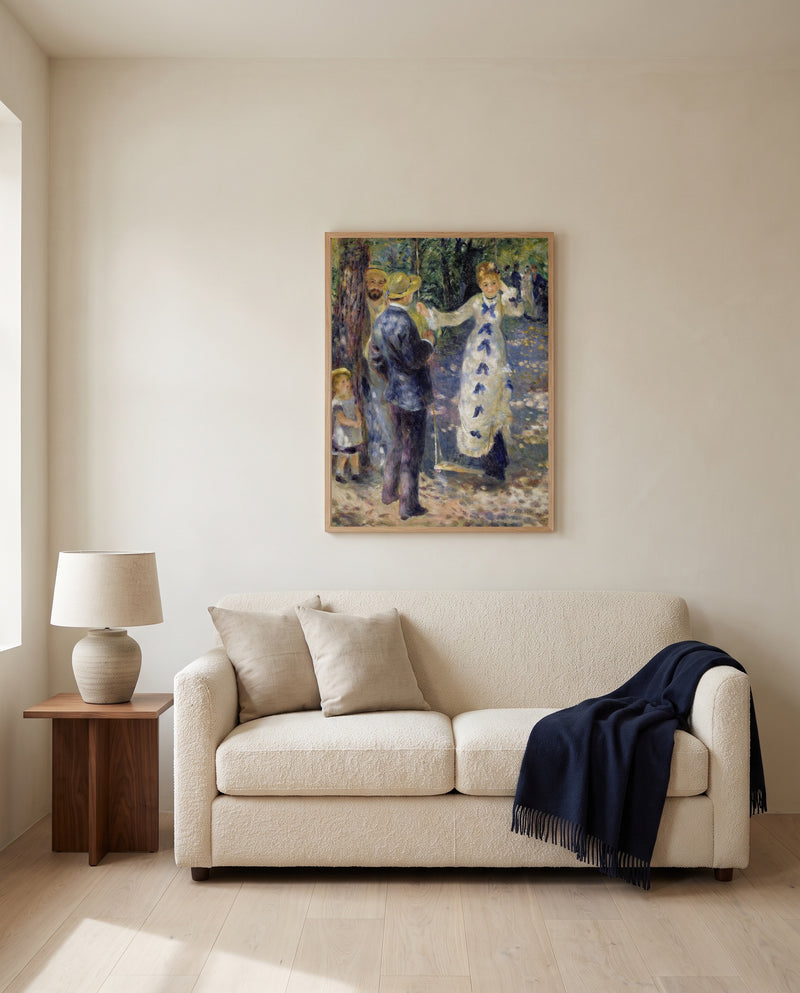 The Swing by Pierre-Auguste Renoir framed in natural oak above a cream sofa in a warm living room