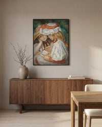 Two Girls Reading by Pierre-Auguste Renoir in a black frame above a walnut sideboard in a dining room