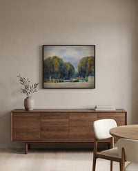 Versailles by Pierre-Auguste Renoir in a black frame above a walnut sideboard in a dining room