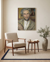 Victor Chocquet by Pierre-Auguste Renoir as a stretched canvas above a linen lounge chair in a reading corner