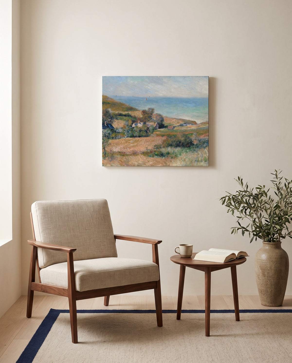 Seacoast near Wargemont by Pierre-Auguste Renoir as a stretched canvas above a linen lounge chair in a reading corner