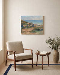 Seacoast near Wargemont by Pierre-Auguste Renoir as a stretched canvas above a linen lounge chair in a reading corner