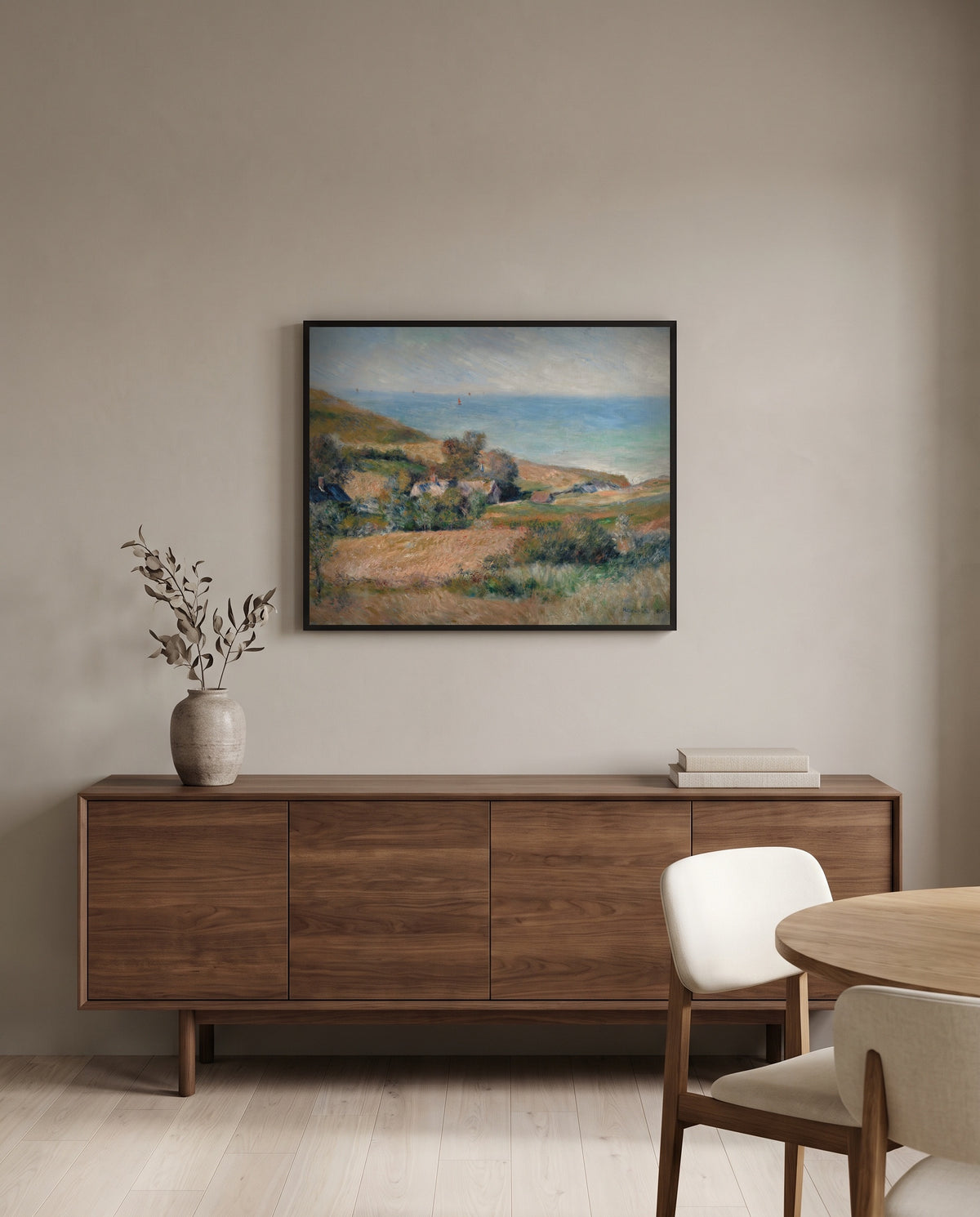 Seacoast near Wargemont by Pierre-Auguste Renoir in a black frame above a walnut sideboard in a dining room