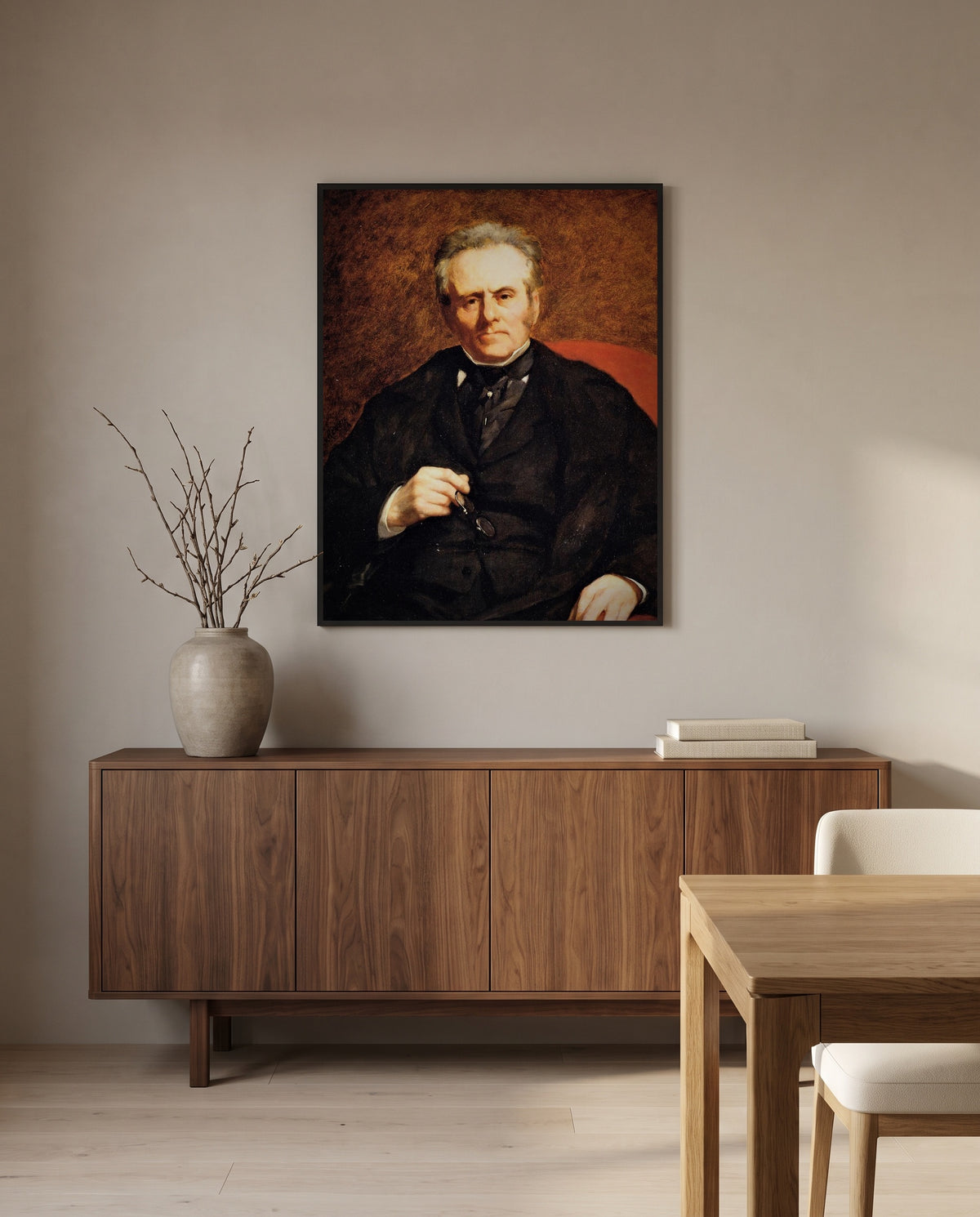 William Sisley by Pierre-Auguste Renoir in a black frame above a walnut sideboard in a dining room
