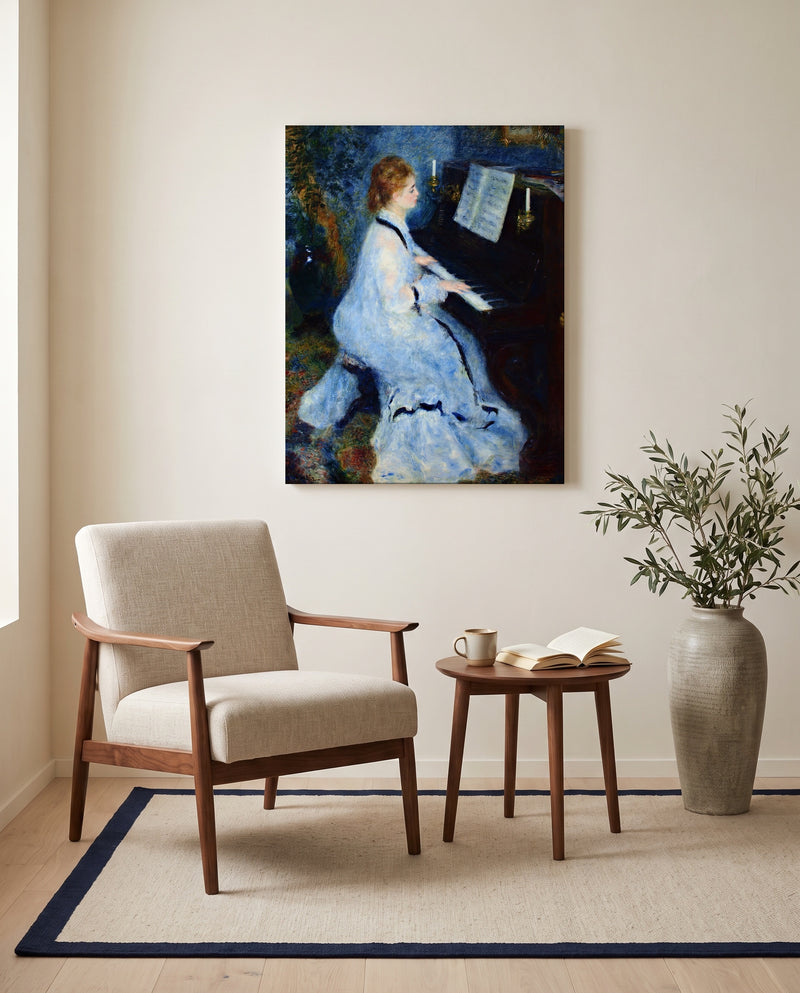 Woman at the Piano by Pierre-Auguste Renoir as a stretched canvas above a linen lounge chair in a reading corner