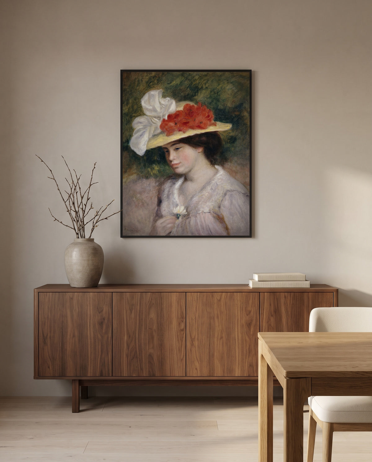 Woman in a Flowered Hat by Pierre-Auguste Renoir in a black frame above a walnut sideboard in a dining room