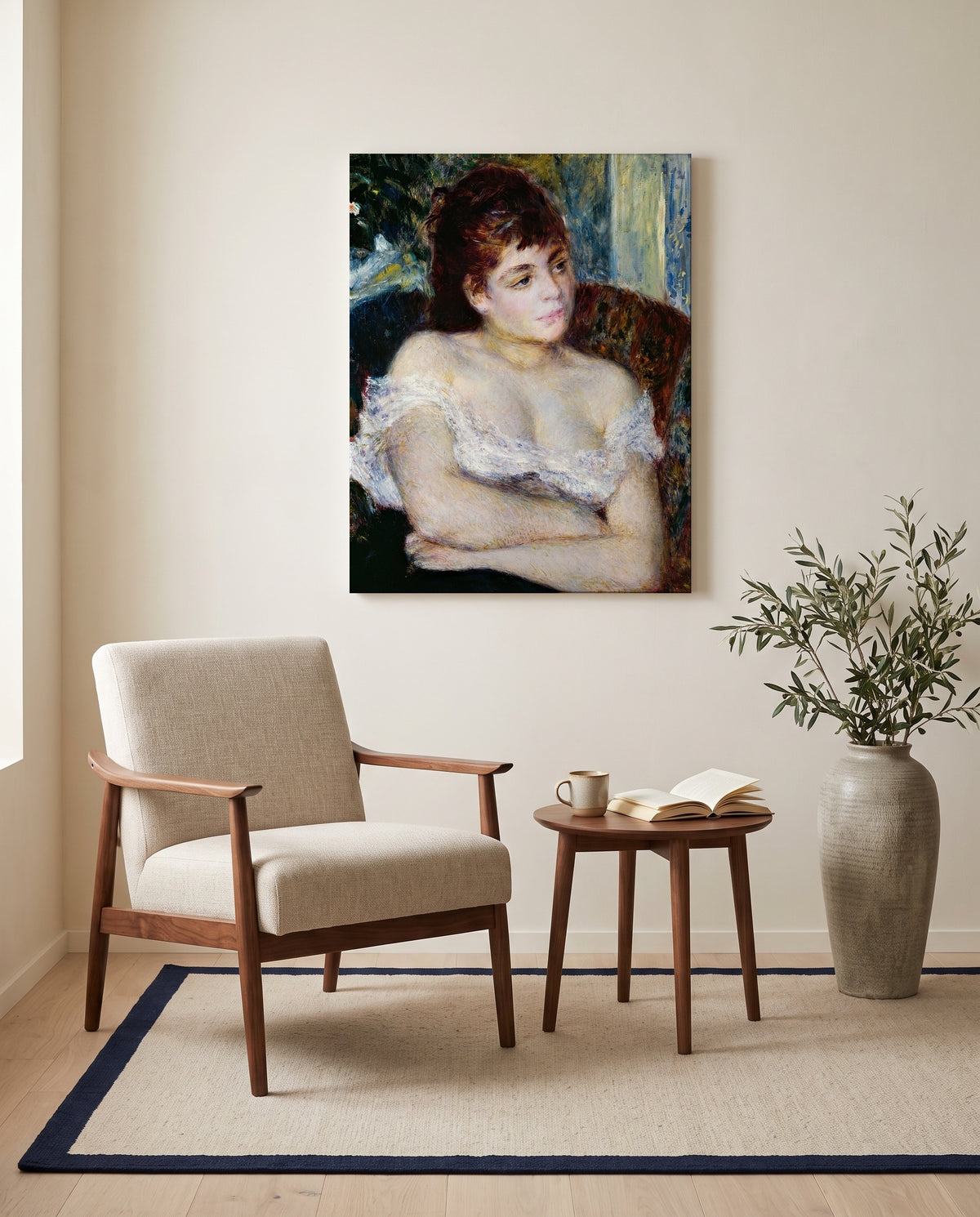 Woman in an Armchair by Pierre-Auguste Renoir as a stretched canvas above a linen lounge chair in a reading corner