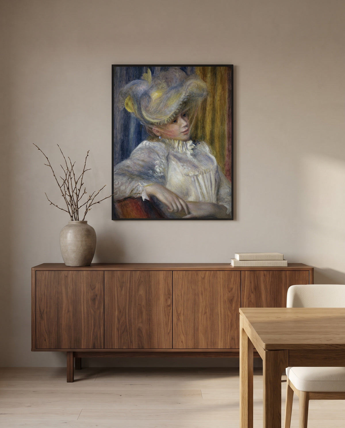 Woman with a Hat by Pierre-Auguste Renoir in a black frame above a walnut sideboard in a dining room