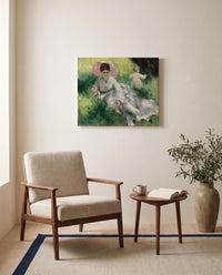 Woman with Parasol and Child by Pierre-Auguste Renoir as a stretched canvas above a linen lounge chair in a reading corner