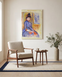 Young Girl in a Blue Dress by Pierre-Auguste Renoir as a stretched canvas above a linen lounge chair in a reading corner